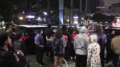 Protesters protesting the death of an armed robber in San Diego, CA attack a man holding a puppy for disagreeing with their protest. The protester "medics" then scream at the cameraman to stop filming while the assailant runs away.
