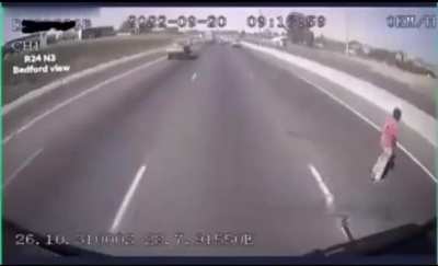 An guy tries to cross the highway and of course he gets hit by a car. South Africa