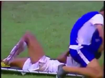Trying to lift up a soccer player