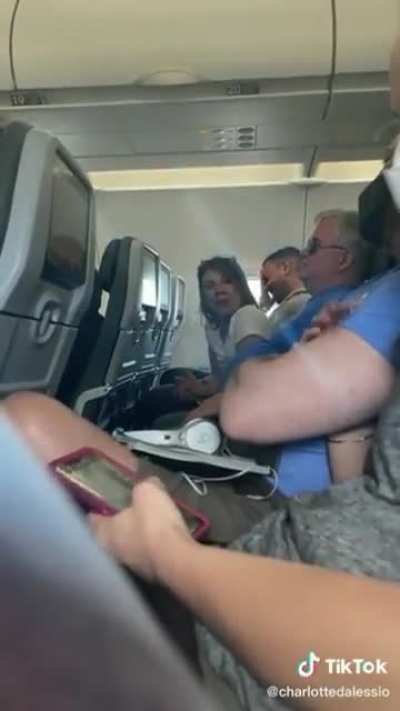 Florida MAGA dumbfucks hurl homophobic slurs and refuse to get off a plane. At the end, the wife says she's convinced it's because they're Trump supporters.