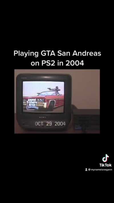 Playing Grand Theft Auto: San Andreas on PlayStation 2 in 2004.