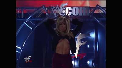 Always loved her wearing those "one button is all that keeps the top on" getups