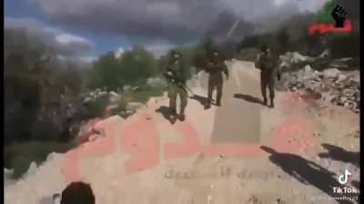 "Bring back my brother, you cowards" brave Palestinian child confronts armed Israelis.