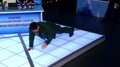 Chechen dictator and Putin puppet Kadyrov goes on TV and tries to demonstrate how easily he can do push ups