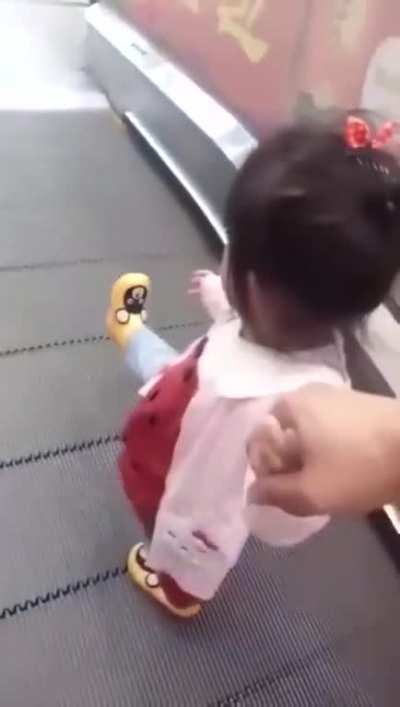 Textbook travelator exit.