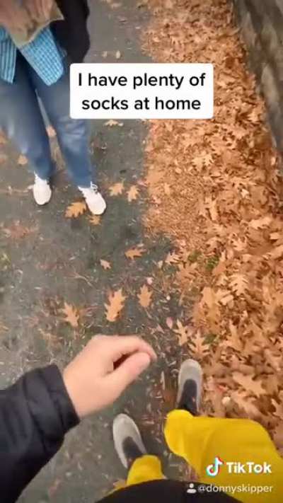 Selling his socks to a man in need