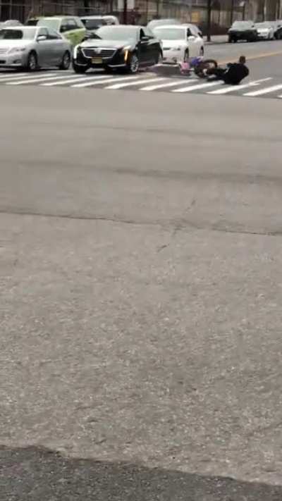 Officer runs a red light in Harlem on a Dirt Bike