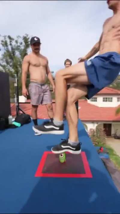 Man manages to balance even after getting flung from the trampoline