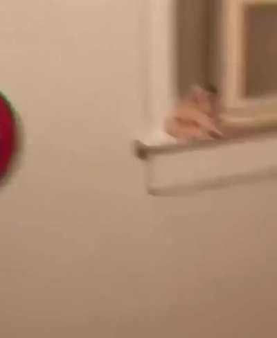 Man misses dart board