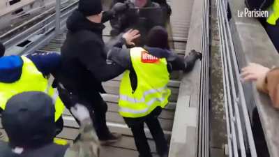 Guy in the black coat dives into the fight
