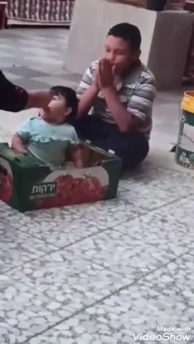 Mohammed al-Alami playing with his little sister. His father, when speaking about his son, said, "Mohammed was my whole life. They snatched him from my heart."