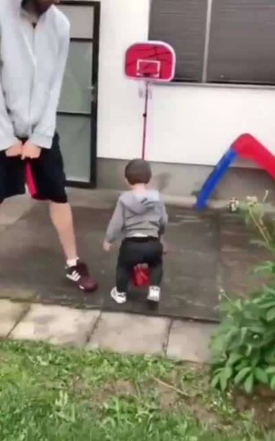 18 month old scores his first basket with his family as his teammates