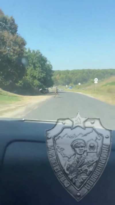 Russian footage from inside a vehicle driving to the bridge over the Seym river right during the Ukrainian attack. Near Karyzh, Kursk Oblast, Russia.