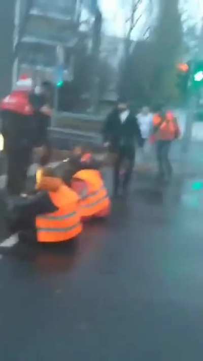 "Last Generation" climate protesters who glued themselves to a street are being removed by residents of Berlin