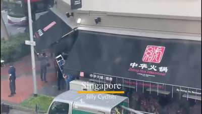 People attacking cleaver wielding man who attacked a lady