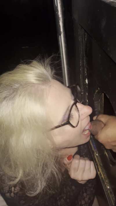 Enjoying some yummy cum delivered by a friendly uncut booth neighbor at the Fantasyland Gloryhole. I love taking it in my mouth . See more at link in comments