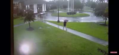 Walking in a park while raining