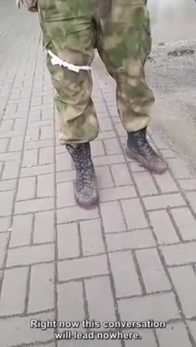 Ukranian woman confronts Russian soldier