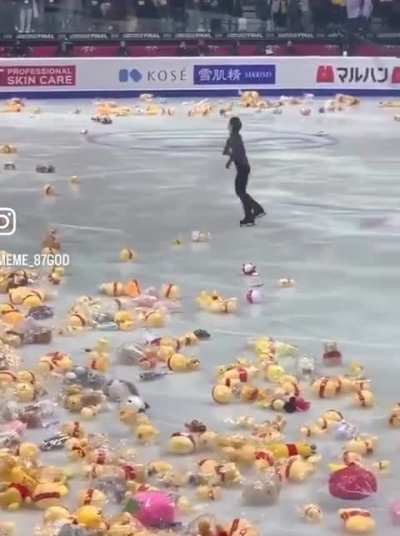 The moment Yuzuru Hanyu's performance ends, a massive barrage of Winnie the Pooh plushies gets thrown in.