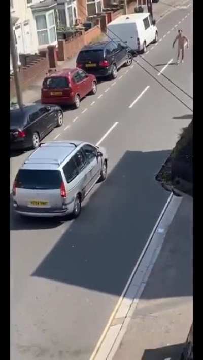 Angry Naked man in the UK feat. Little person on a bike