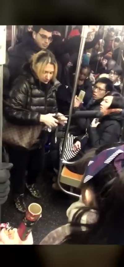 Lady physically abusing someone before holding the train and calling the police... over virtually nothing