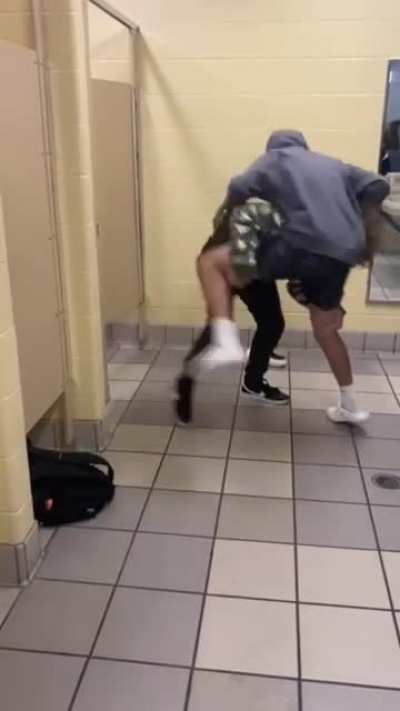 High School Fight - Kid Ends Up in a Trash Can
