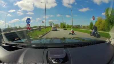 Guy knocks down a learning biker and then checks his car first