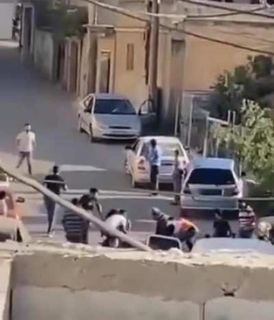 Is this a war crime? Indiscriminate killing of unarmed civilians in the back...