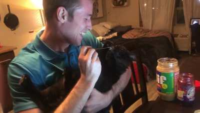 Guy mesmerizing by cat
