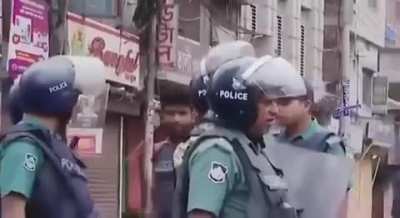 Bangladeshi police armed forces battalion using live rounds against protesters in Dhaka on 5 August 2024. 