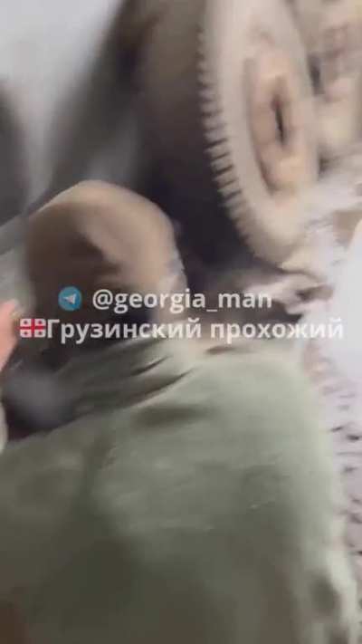 Soldiers from the Muslim Corps of the Caucasus unit use a 9v battery to detonate explosives in Bakhmut.