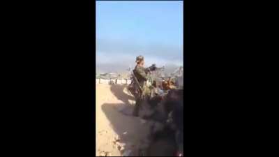Libyan rebel gets sniped trying to Rambo a PKM. 2011 