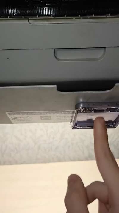 Used broken flip phone to fix a broken printer (didn't hold the paper tray)