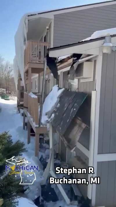 Melting ice and snow cause a partial roof collapse at an apartment complex