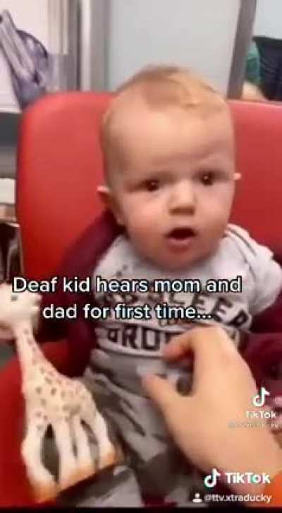 Deaf baby hears his parents for the first time