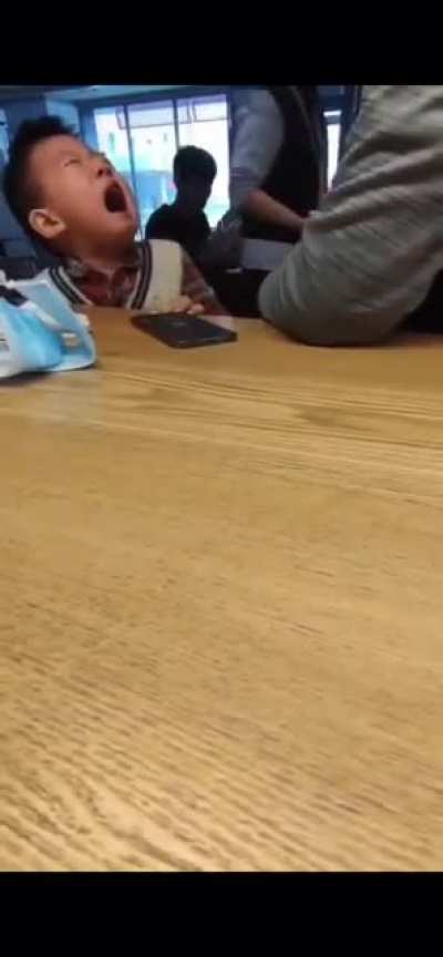 Video posted on Chinese social media of father disciplining his son