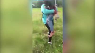 Kid holds onto kite string, falls down
