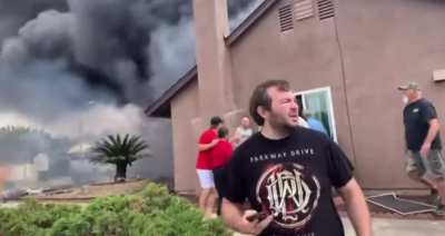 Neighbors help people out of home that was hit by a plane in Santee