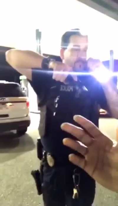 officer told him to shut his car off. as he reached to put it in park, officer yells out that he has a gun. when he asks the officer what he did wrong, officer says &ldquo;you were told to leave the parking lot and you came back.&rdquo; man says &ldquo;how did I come