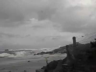 WCGW walking by the beach during a storm