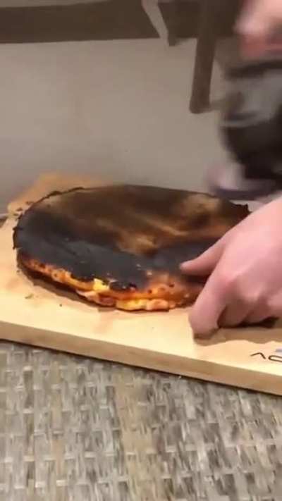 removing the burnt part of a pizza