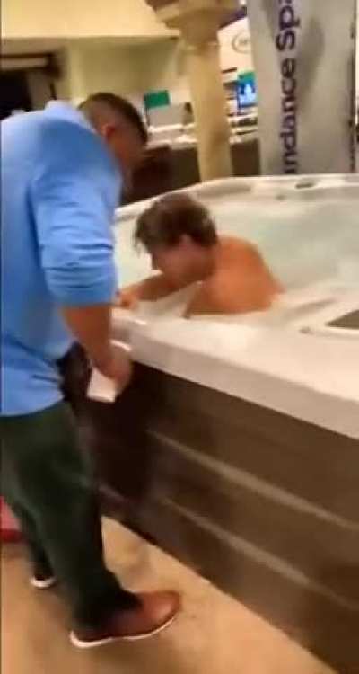Kid jumps in a hot tub at a convention then an altercation ensues 