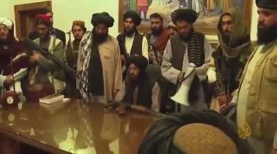 Taliban militants reciting Quran in the presidential palace in kabul. Government officials have fled the buildings and the taliban have formed an interim government.