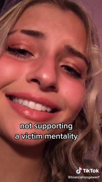 Upper middle class, straight white girl, acts like she is oppressed.