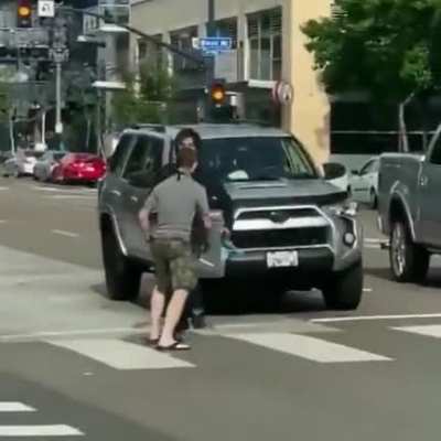 Guy tried his best to avoid fight, swiftly took out the agitator, then apologized