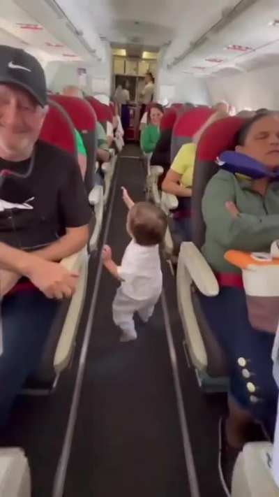 A kid saying hello to everyone