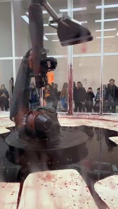an art installation where the machine is leaking hydraulic fluid. it's trying to keep it inside, but the leak will kill it anyway. @nicwashere