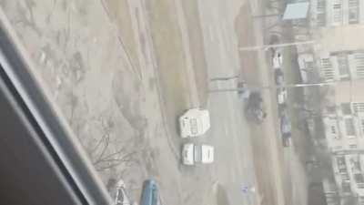 fire exchange in the middle of a city + tank drove in civilian car