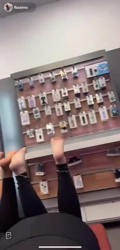 girl and co-worker show soles on the clock