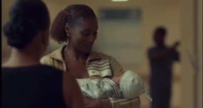 Lady picks up baby